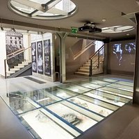A room showing film and photos of the destruction & reconstruction of the Old Town.
