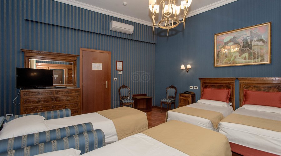 Master Bedroom in the Standard Quadruple Room at the Hotel Impero