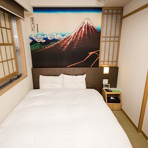 Hotel Dormy Inn Akihabara in Chiyoda, image may contain: Furniture, Bedroom, Bed, Indoors