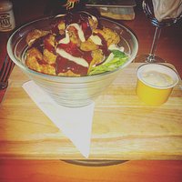 Barbeque Chicken Wings on a bed of Salad with blue cheese dressing