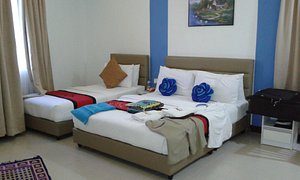 Motel Fyna in Kangar, image may contain: Dorm Room, Bed, Furniture, Rug