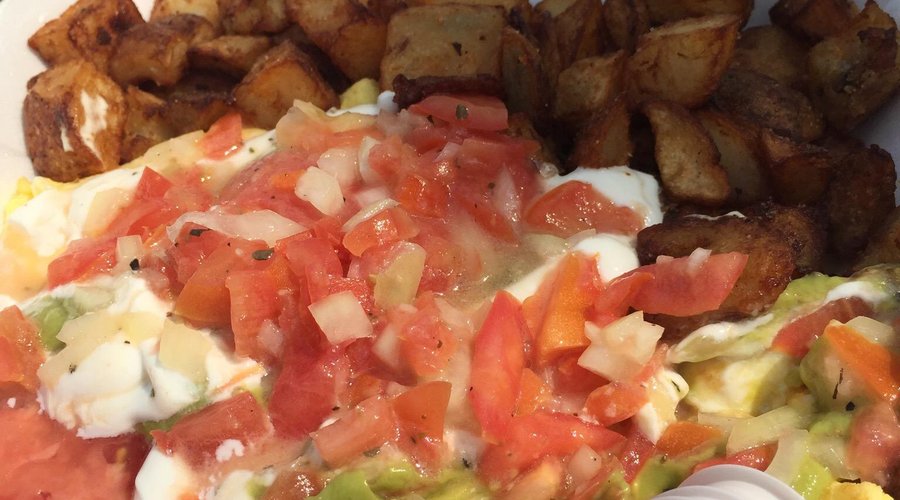 Omelette Santa Rosa with Monterey Jack cheese, guacamole sour cream poco de gallo and home fries