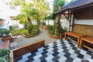 ZEN Rooms Station 3 Angol Road in Panay Island, image may contain: Hotel, Resort, Villa, Backyard