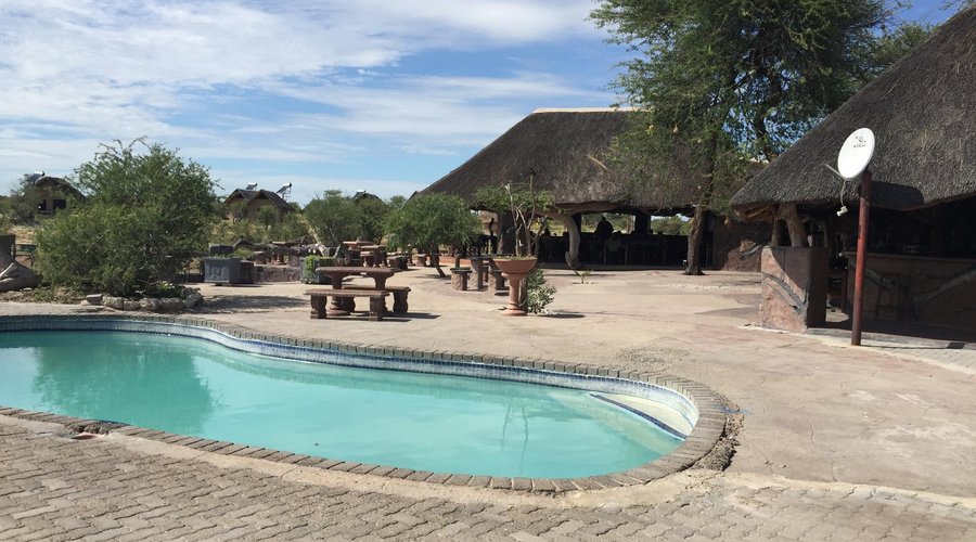 Pool with dining area in the background