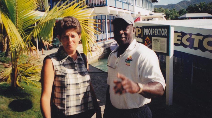 Lang, the scuba instructor in front of the Prospector and Callaloo Restaurant and Scuttlebut Pub