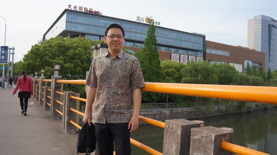 Near the river at the opposite side of the market building