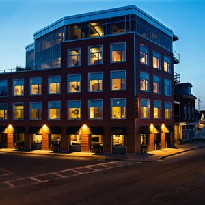 250 Main Hotel in Rockland, image may contain: Door, Bed, Furniture, Chair