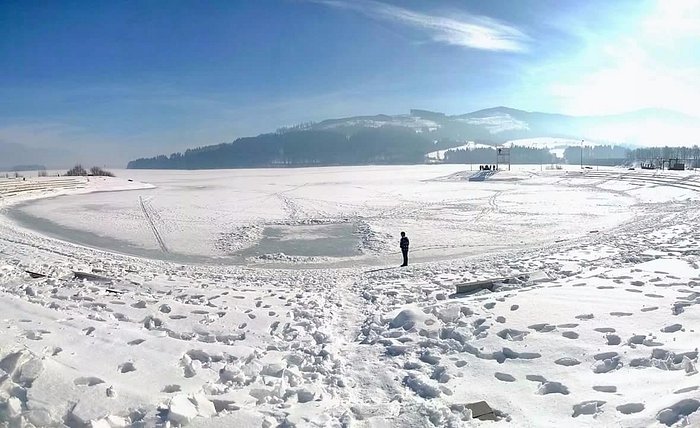 Frozen lake in winter amidst the Attraction mountains