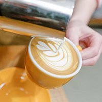 pouring a flat white