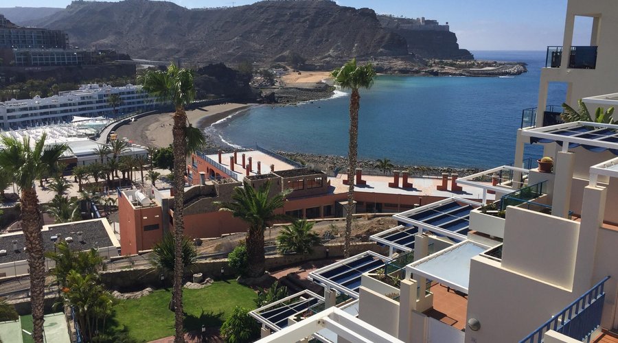 Views from a top (5th floor) apartment at Monte Golf Suits in Gran Canaria looking over Playa de