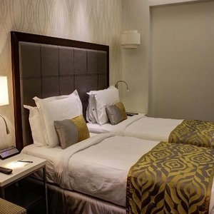 The Sahil Hotel in Mumbai, image may contain: Chair, Furniture, Hotel, Bed