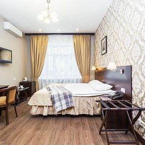 M-Hotel in St. Petersburg, image may contain: Bed, Furniture, Bedroom, Chair