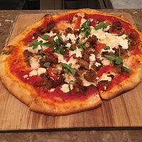 The Italian sausage pizza. Look at that fresh oregano!