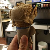 Single scoop of Kona coffee on a sugar cone. As you can see in the photo moderate size scoops,