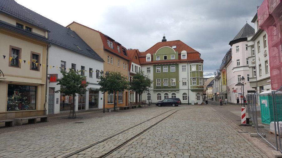The hotel on the market square (green & white building)