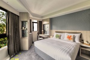 Stanford Hillview Hotel in Hong Kong, image may contain: Home Decor, Interior Design, Cushion, Furniture