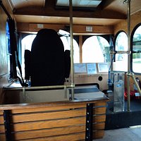 Inside the Trolley in back of the driver.