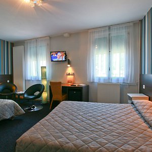 Hotel Panoramic in Bagneres-de-Luchon, image may contain: Furniture, Bedroom, Bed, Indoors