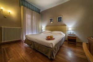 Hotel Maggiore in Bologna, image may contain: Flooring, Corner, Bed, Interior Design