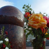 Looking up at the Floating Granite Ball with flowers to the memory of the Roy Wilson Jr. 2007