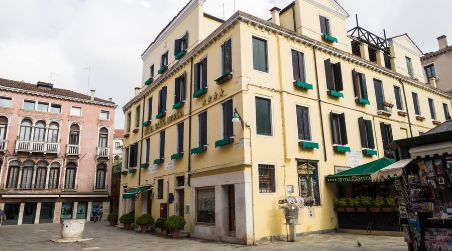 Our room was the two windows in the center left on the third floor facing that very noisy piazza