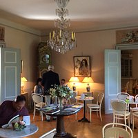 The main dining room with chandelier .