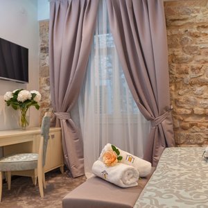 Heritage Hotel Antique Split in Split, image may contain: Home Decor, Bed, Furniture