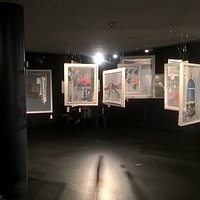 You are encouraged to walk through the "forest" of paintings. Wonderful.