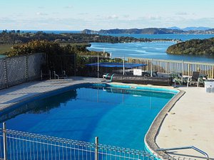 Cook's Lookout Motel in Paihia, image may contain: Pool, Water, Swimming Pool, Chair