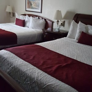 Homestead Apart-Hotel in Pleasantville, image may contain: Couch, Furniture, Painting, Table