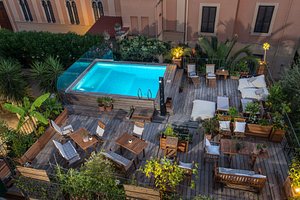 Palm Gallery Hotel in Rome, image may contain: Pool, Water, Swimming Pool, Outdoors