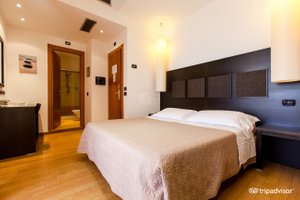 HOTEL FLORIDA LERICI in Lerici, image may contain: Interior Design, Bed, Furniture, Flooring