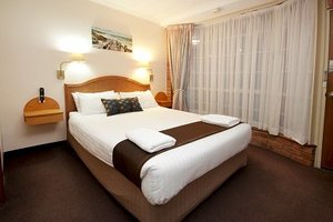 Sapphire Waters Motor Inn in Merimbula, image may contain: Furniture, Interior Design, Home Decor, Cushion