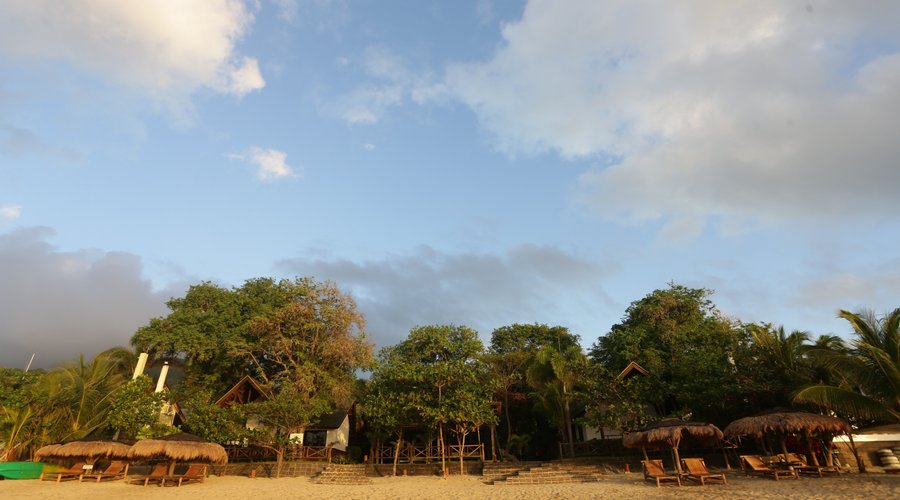 Our 40 meters Beach Front with views of Mt. Daguldol and landscape filled with lush foliage.