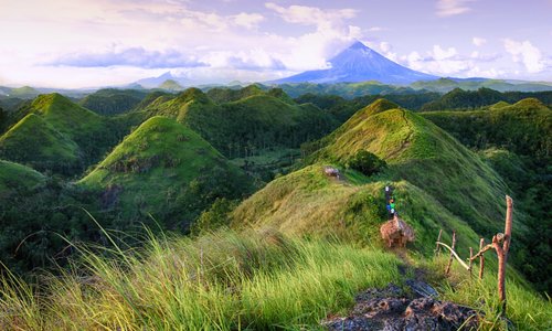 QUITINDAY GREEN HILLS. Serpentine, sinuous, sensuous: such are the rolling contours of Camalig's