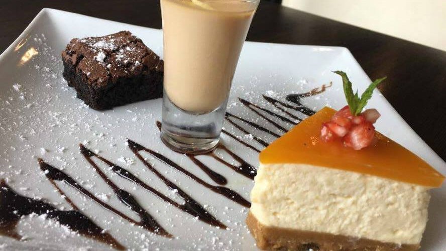 Trio of Dessert. Homemade Mango cheese cake, Masala chai pannacotta and warm chocolate brownie