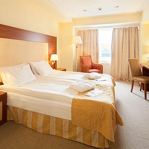 spooky town haunted hotel SunFlower Park Hotel in Moscow, image may contain: Table Lamp, Lamp, Furniture, Chair