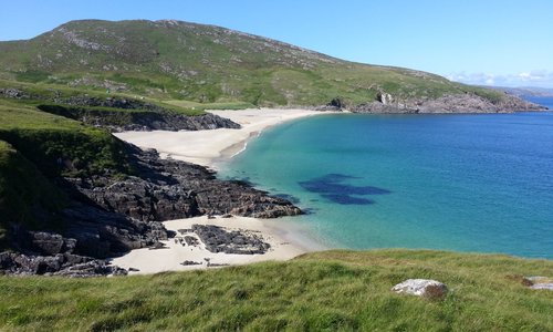 Beaches on East coast of Mingulay- kayaks and tents in distance