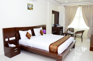 Hotel Le Coorg in Madikeri, image may contain: Furniture, Chair, Bed, Home Decor