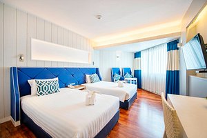 Jomtien Palm Beach Hotel & Resort in Pattaya, image may contain: Hotel, Furniture, Resort, Bedroom