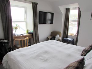 Scalloway Hotel in Mainland, image may contain: Furniture, Bed, Bedroom, Monitor
