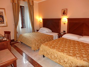 Tmark Hotel Vaticano in Rome, image may contain: Bed, Furniture, Chair, Bedroom