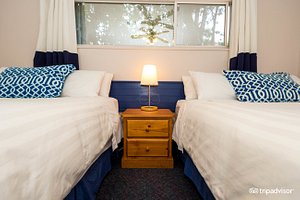 Buccaneer Inn in Vancouver Island, image may contain: Dorm Room, Furniture, Bedroom, Bed