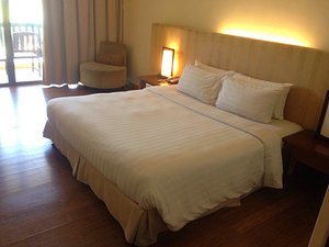 Damai Puri Resort & Spa in Kuching, image may contain: Bed, Furniture, Cushion, Home Decor