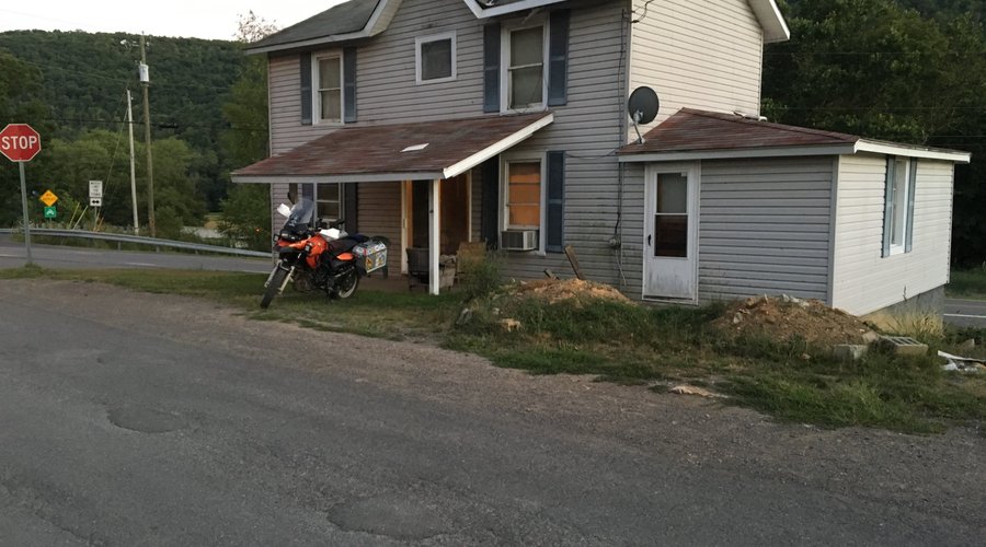 This is the crack house we rented a room in. Boarded windows. Foundation was being dug out.