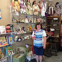Loretta in the gift shop with her traveling doll.