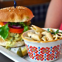 Gullino Gooleenoh, chicken breast on ciabatta with tomato, onion, melted asiago, and pesto mayo.