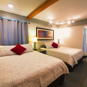 Ski Inn Anchorage in Girdwood, image may contain: Bed, Furniture, Bedroom, Lighting