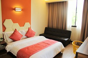 Memoire Hornbill Hotel in Kuching, image may contain: Couch, Furniture, Bed, Bedroom