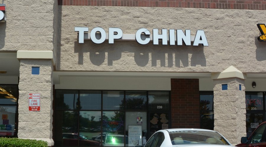 In the middle of a strip mall. GNC of left, Which Wich on right